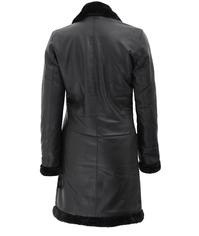 A black leather long shearling coat with faux fur lining at the collar, front, and cuffs, displayed on a mannequin.