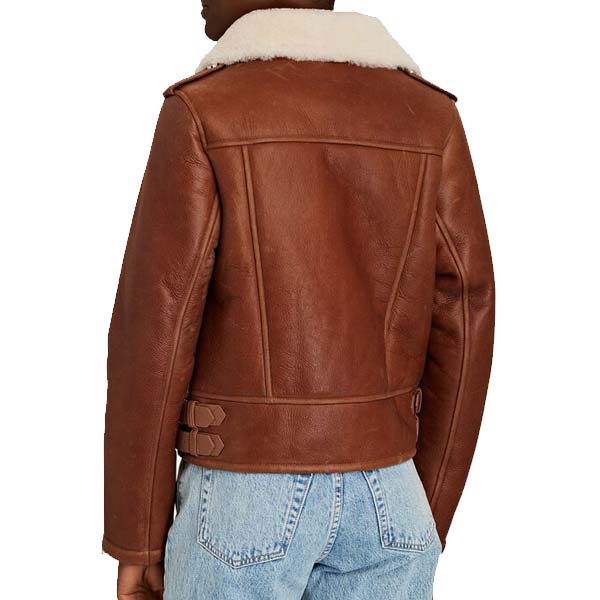 A brown leather aviator jacket with a pointed collar, asymmetrical zip front closure, and shearling lining visible on the shoulders.