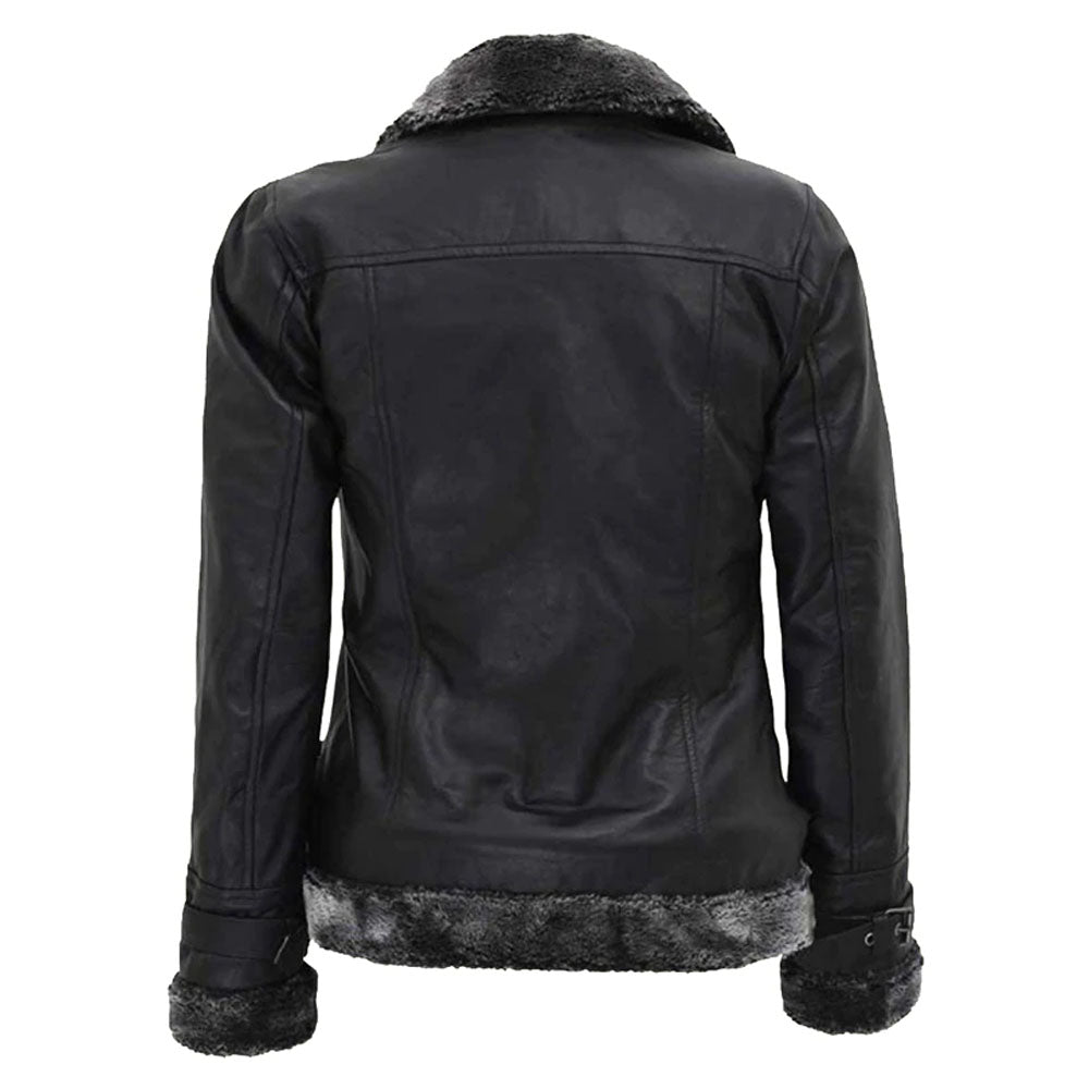 Women's black leather shearling jacket with belted closure, zipper details, and fur lining on the cuffs.